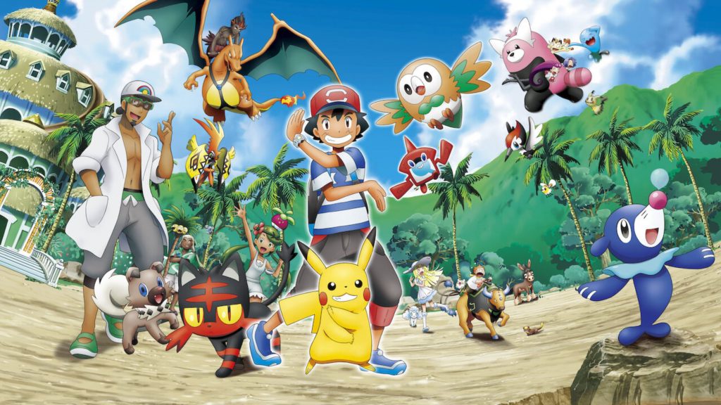 ash, pikachu e outros treinadores e pokemons na areia de uma praia